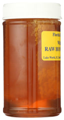 Buzzn Bee jar beside spoon showing size and practical serving benefit