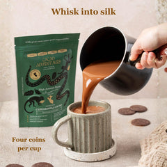 Cacao Adventures preparation in cup being whisked for creamy ceremonial drink
