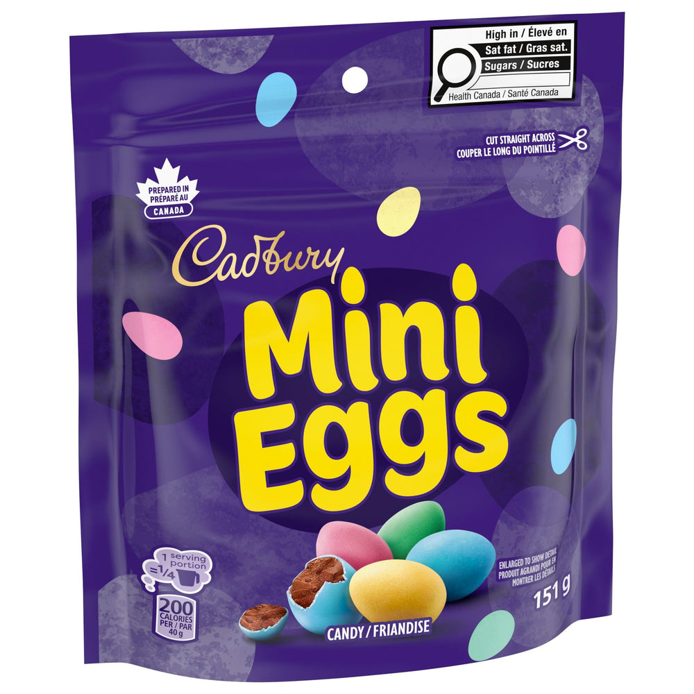 Cadbury Mini Eggs next to a hand for size comparison demonstrating portion-friendly benefit