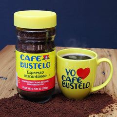 Café Bustelo jar in hand for scale showing compact size and travel-friendly convenience