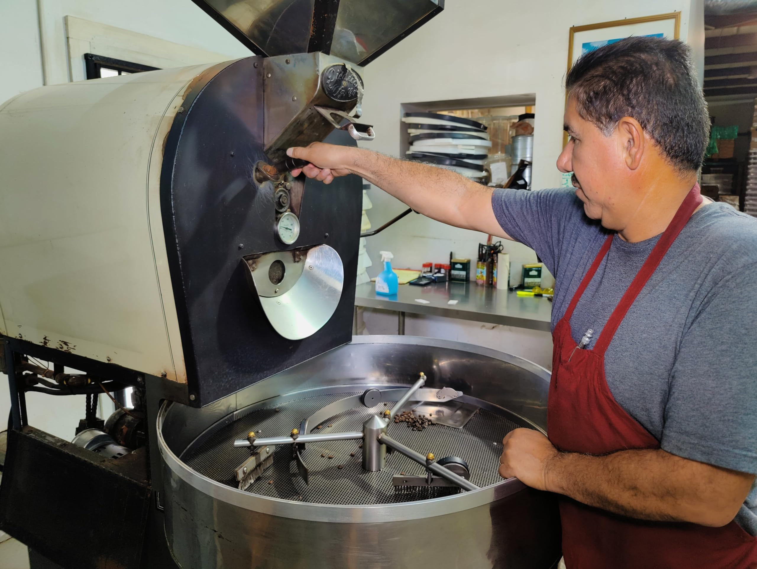 Cafe Don Pedro artisan roaster with small batch drums illustrating careful roasting