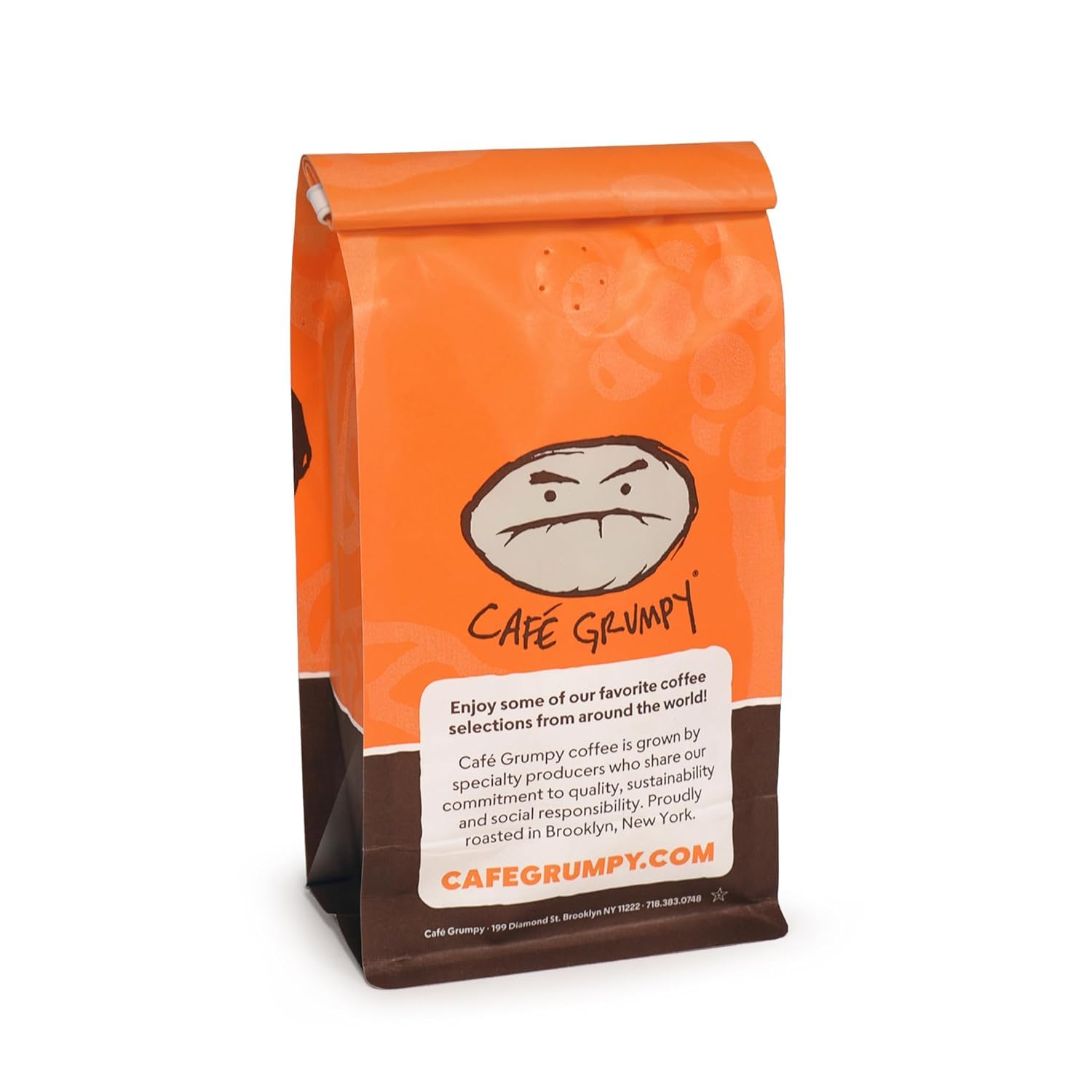 Café Grumpy cup beside dessert, indicates pairing and enjoyment