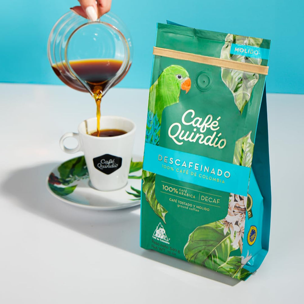 CAFE QUINDIO brewed cup top view displaying smooth low-acid crema