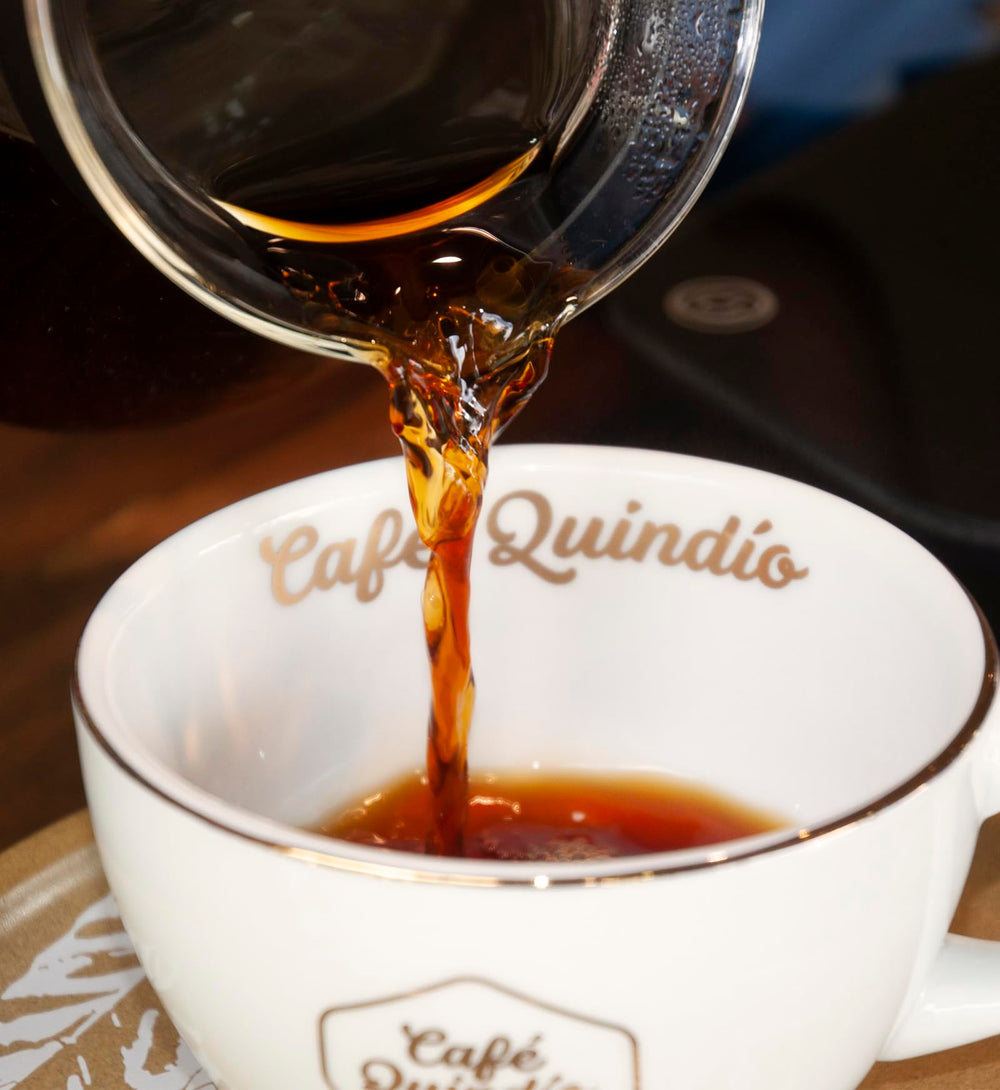 CAFE QUINDIO label and certification seal confirming 100% Colombian benefit