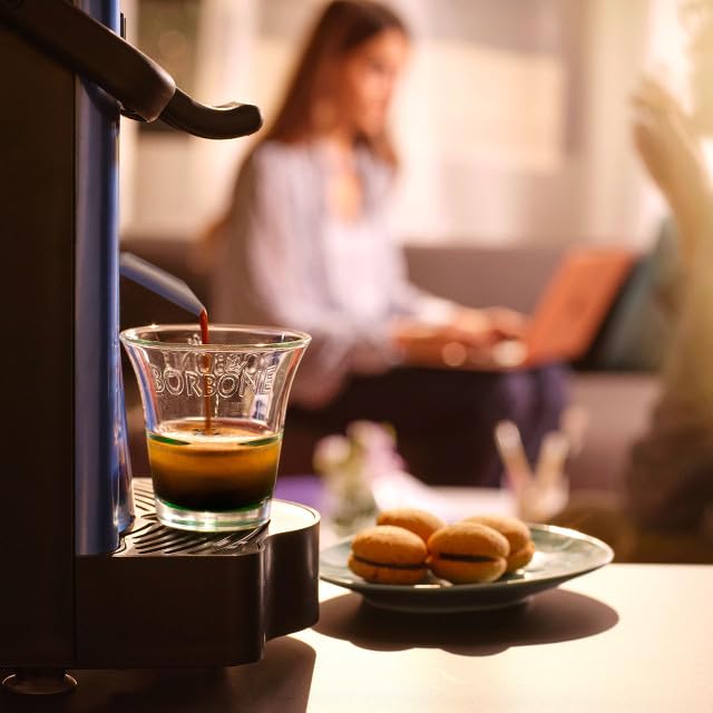 Caffè Borbone kitchen lifestyle serving espresso to show quick morning routine