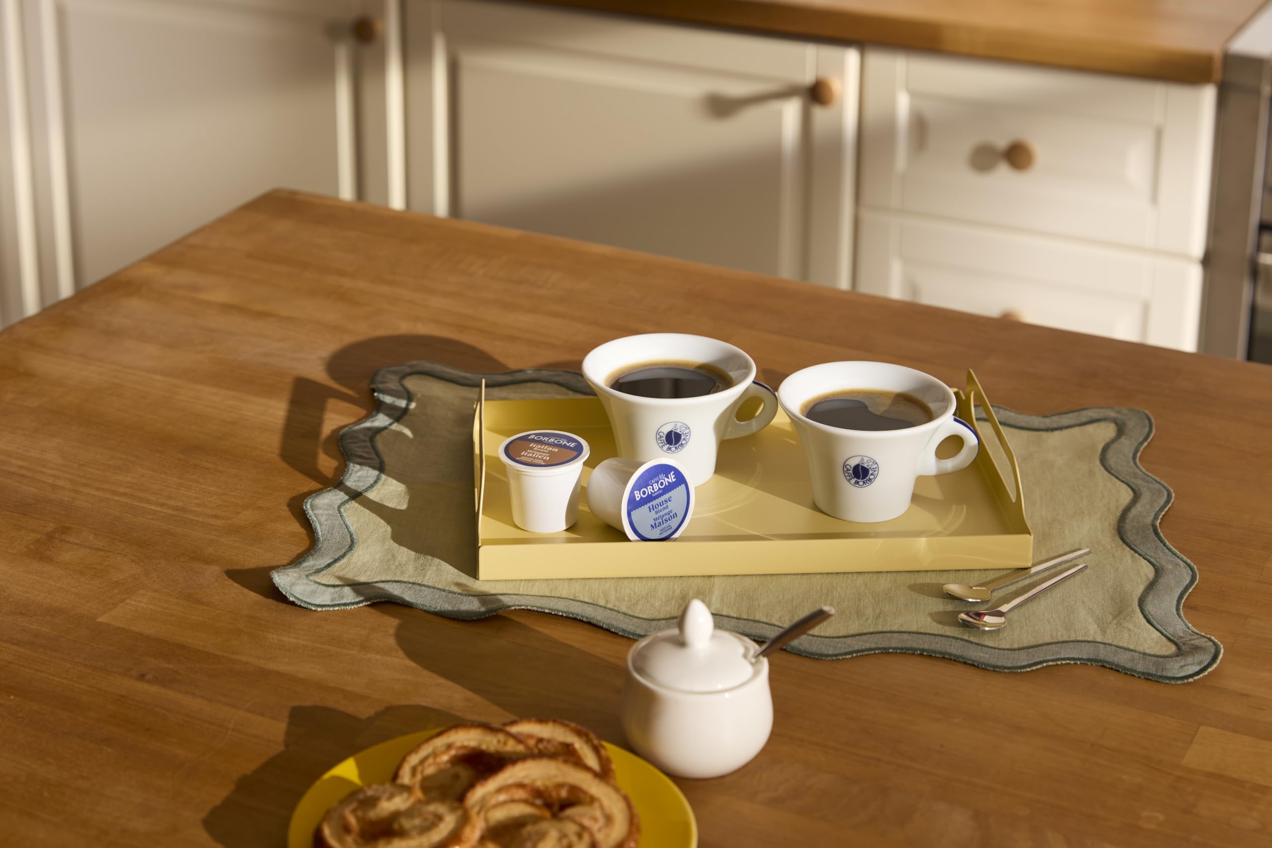 Caffè Borbone poured cup with milk foam showing rich flavor and smooth compatibility for lattes