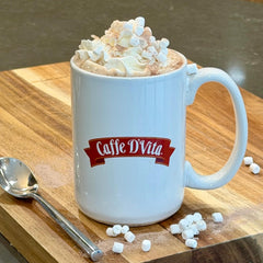 Caffe D'Vita cocoa topped with whipped cream and marshmallows for indulgence
