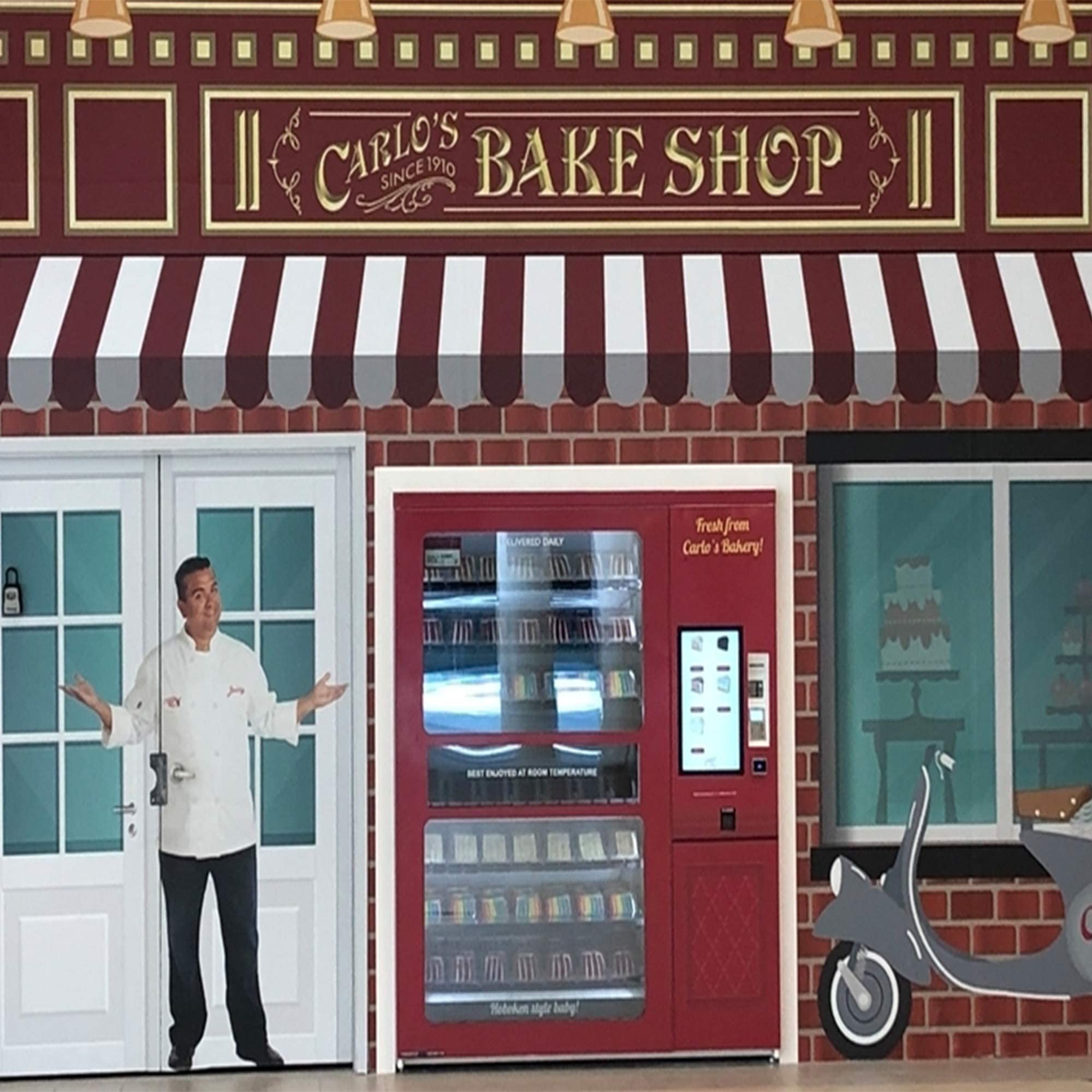Hand holding Cake Boss pod for scale demonstrating single-serve convenience