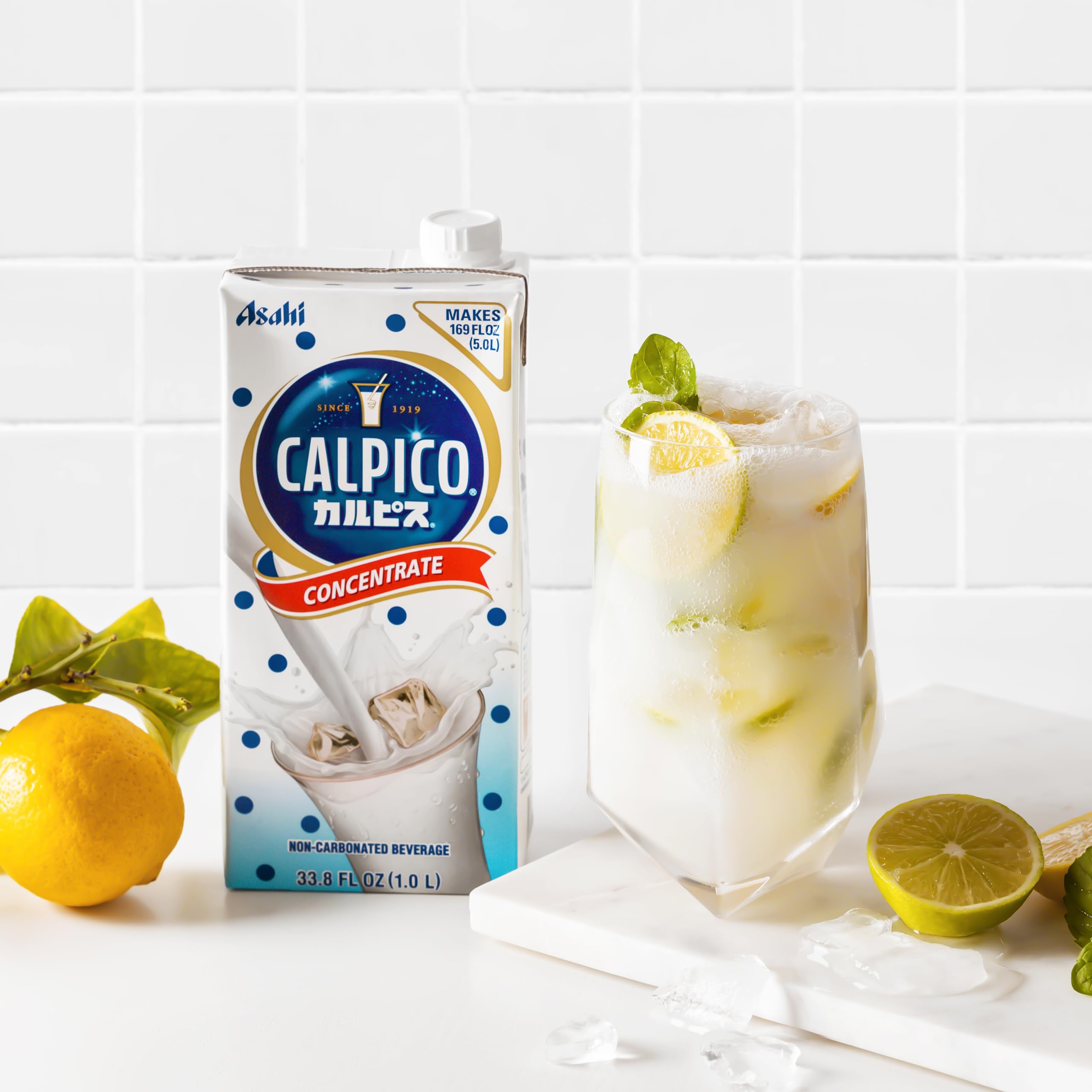 CALPICO bottle next to a measuring cup to demonstrate 33.8 fl oz serving size and portioning