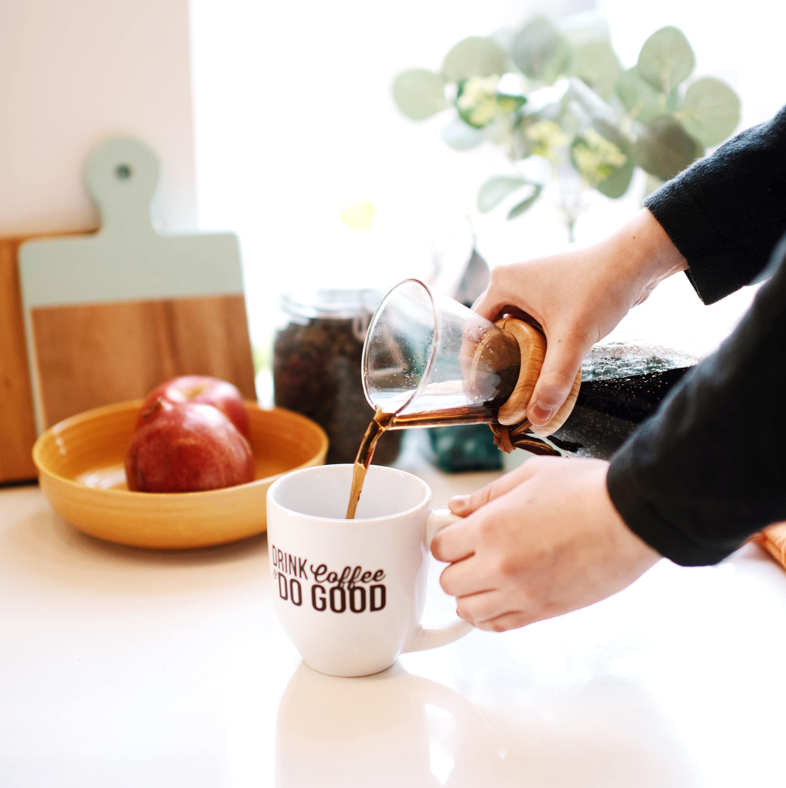 12-ounce Cameron's Coffee bag beside common household items for accurate size comparison