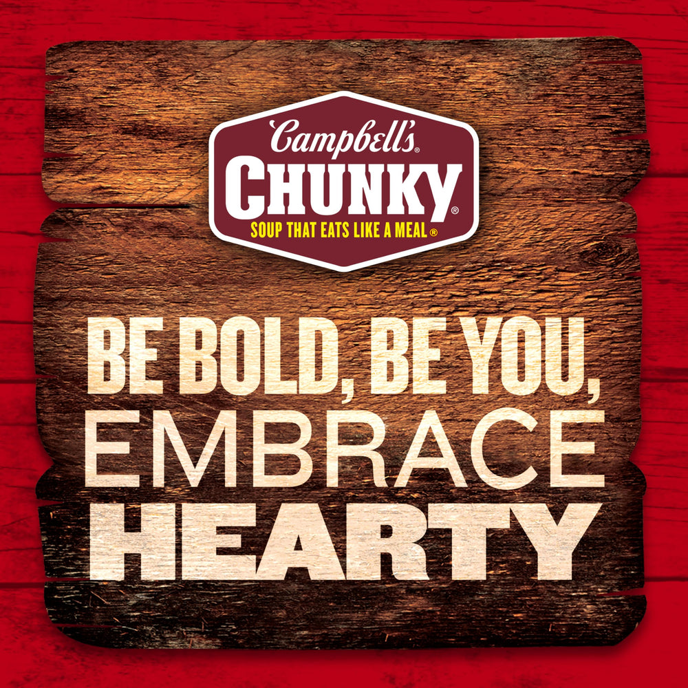 Campbell’s Chunky can in hand to show 16.3 oz size and portion scale