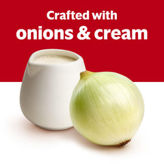 Creamy onion sauce from Campbell's spooned over pork chops illustrating quick meal use