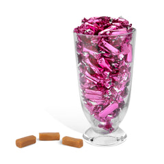 Candy Envy caramels filling a clear jar for easy display and portioning