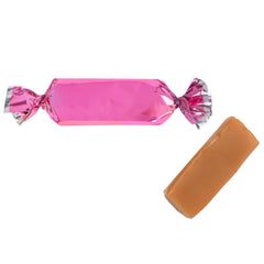 Candy Envy scattered wrapped caramels on table adding bright visual appeal
