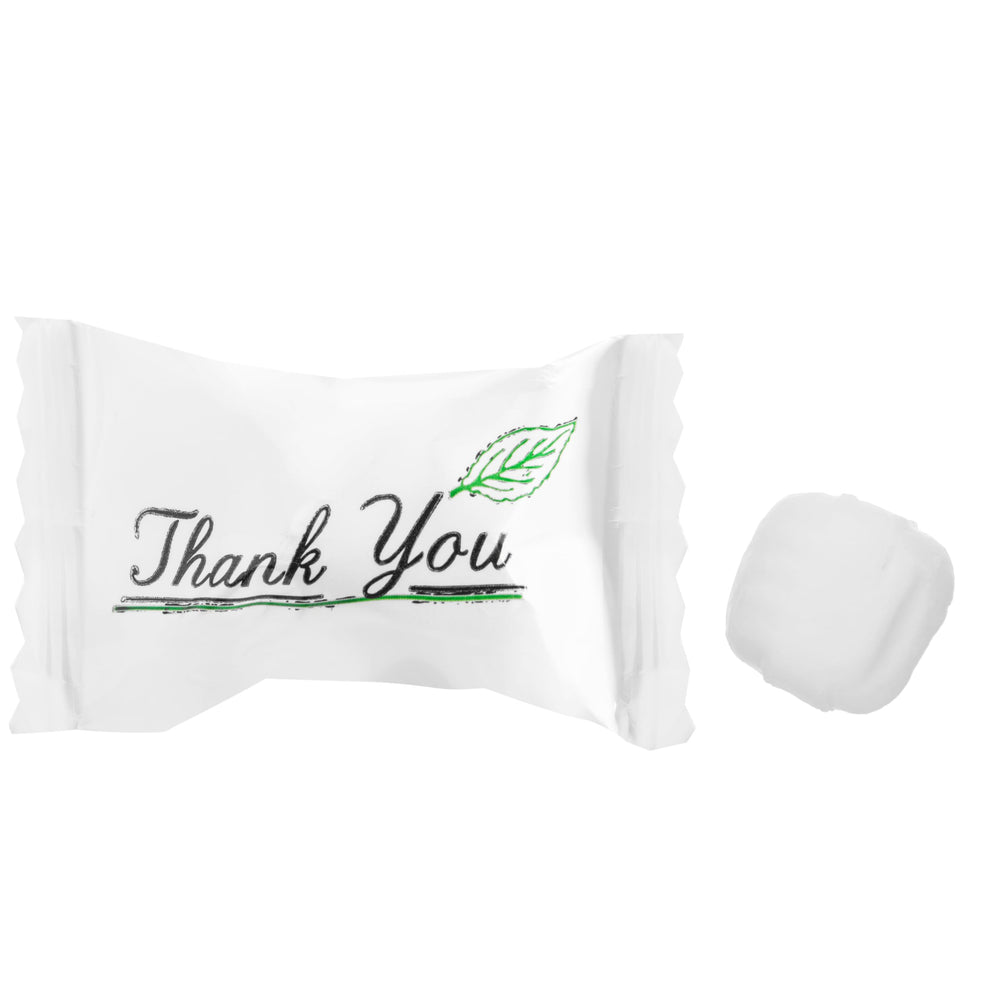 Candy Envy individually wrapped mints scattered, ready for favors and hygienic serving