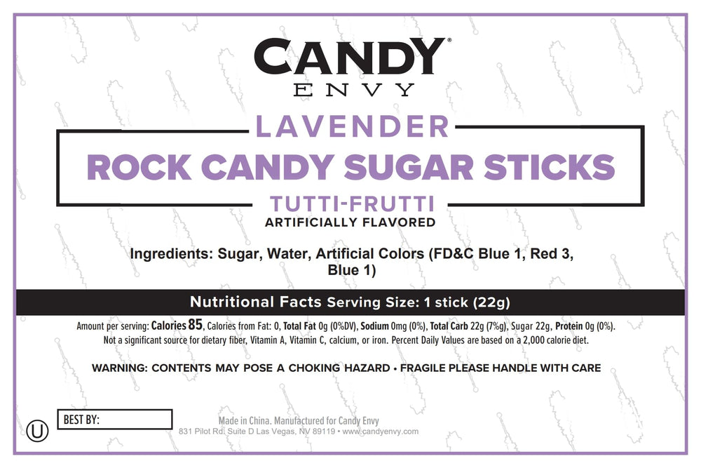 Candy Envy lifestyle table display with sticks as party favors and colorful dessert accents