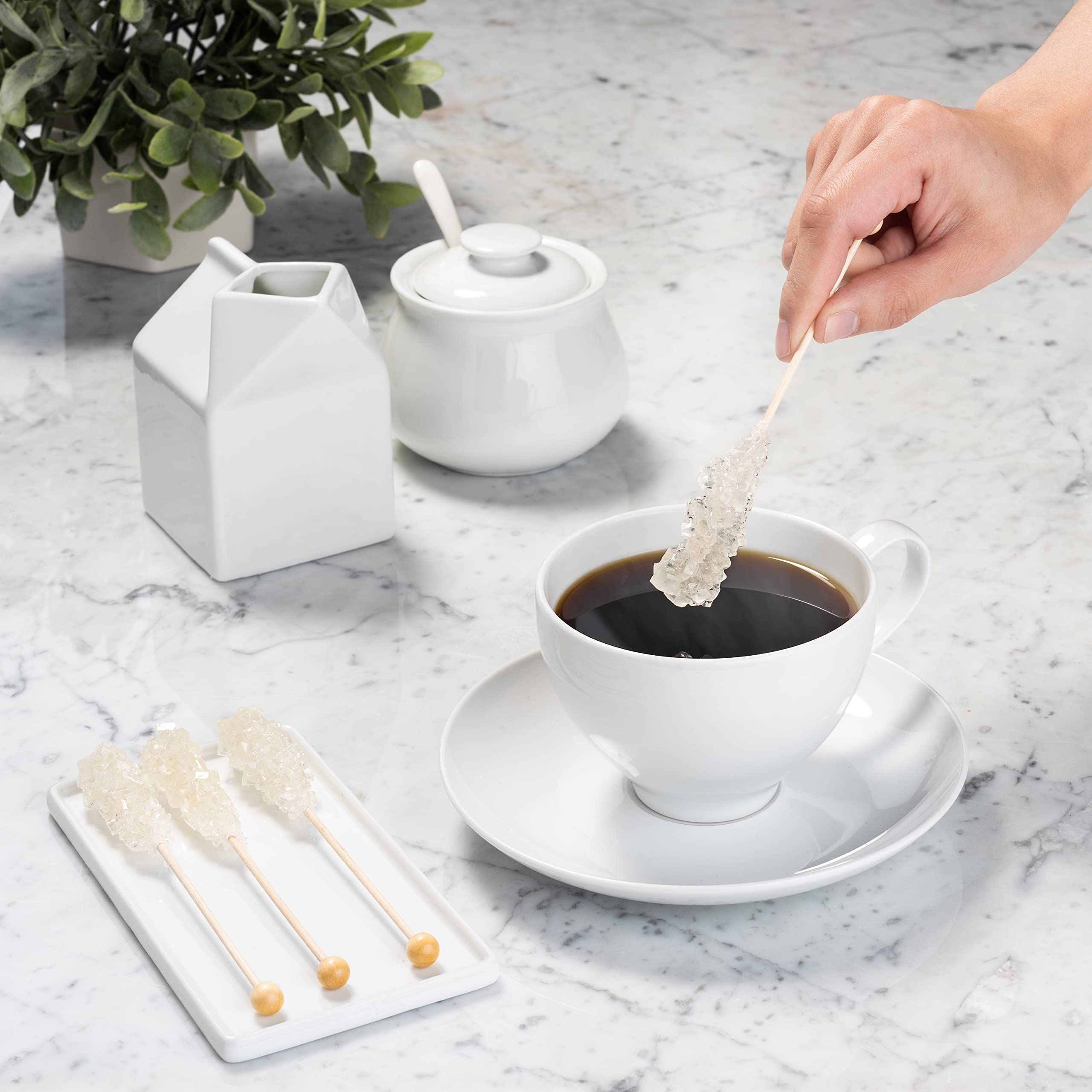 Candy Envy sugar stick stirring a coffee cup demonstrating tidy sweetening and appealing presentation