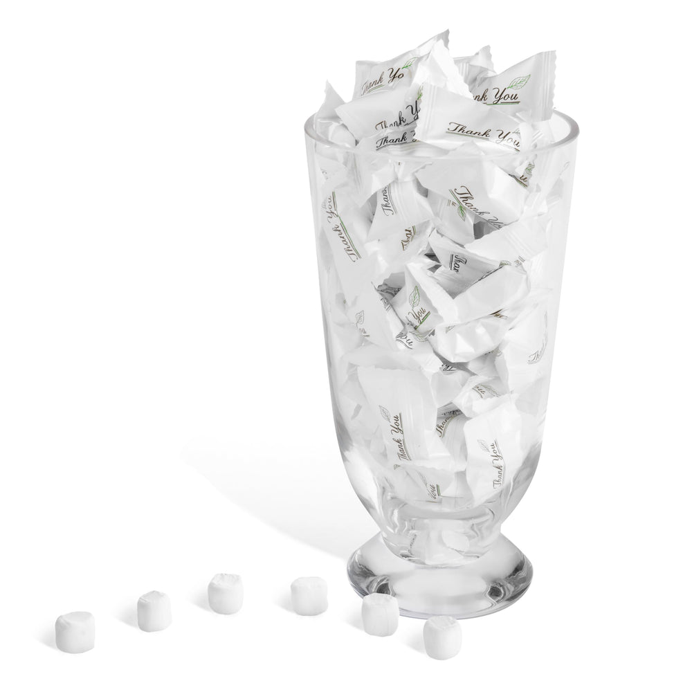 Candy Envy table display at a wedding reception adding elegant, pre-wrapped guest favors
