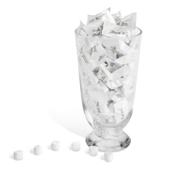 Candy Envy table display at a wedding reception adding elegant, pre-wrapped guest favors
