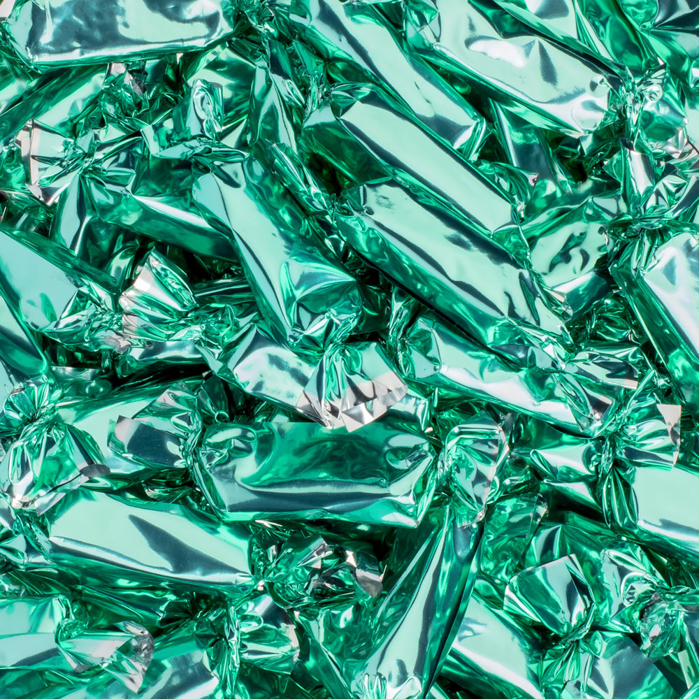 Candy Envy close-up of turquoise wrapper shine, attractive for themed displays