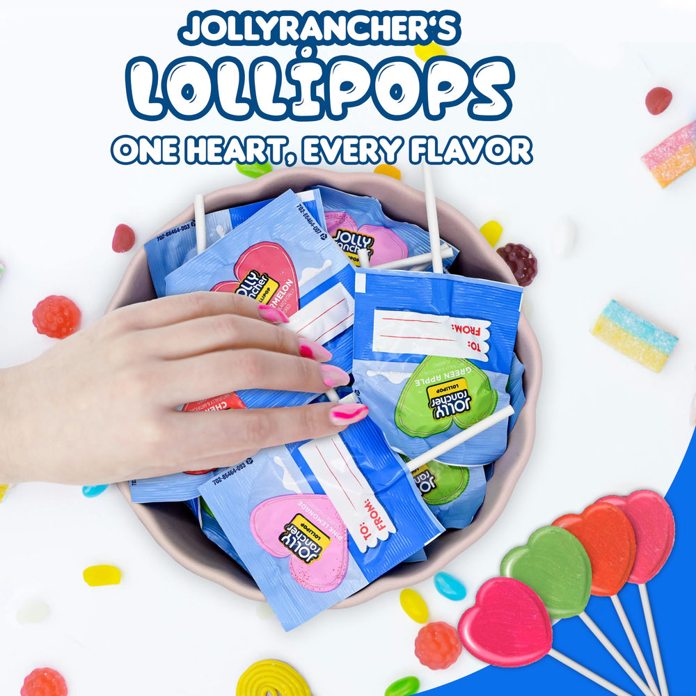 Candylish Jolly Ranchers heart lollipops on a party table in favor bags illustrating easy distribution