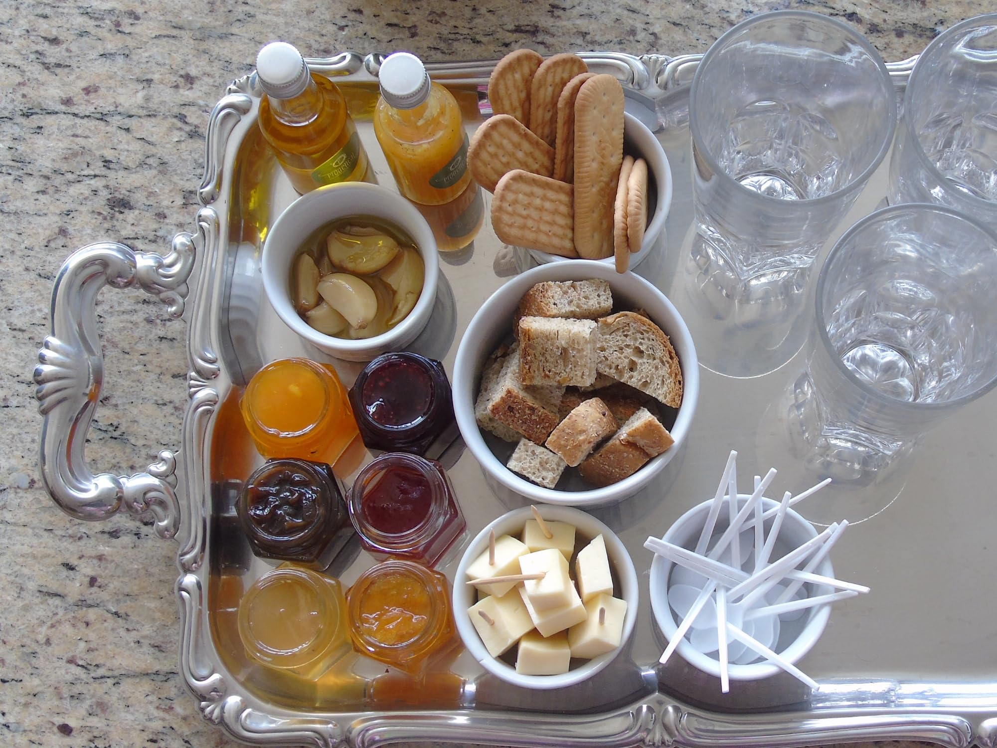Cane River Mayhaw Jelly on cheese board with crackers showing elegant entertaining pairing