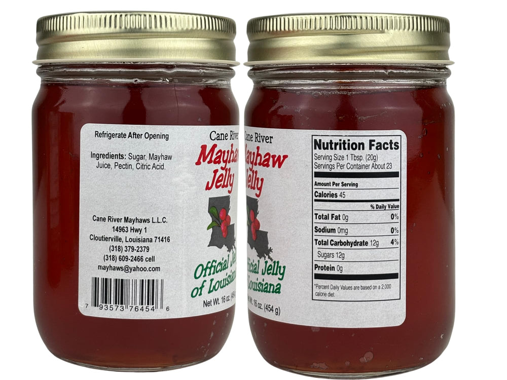 Cane River Mayhaw Jelly open jar with spoon highlighting smooth texture and spreadability