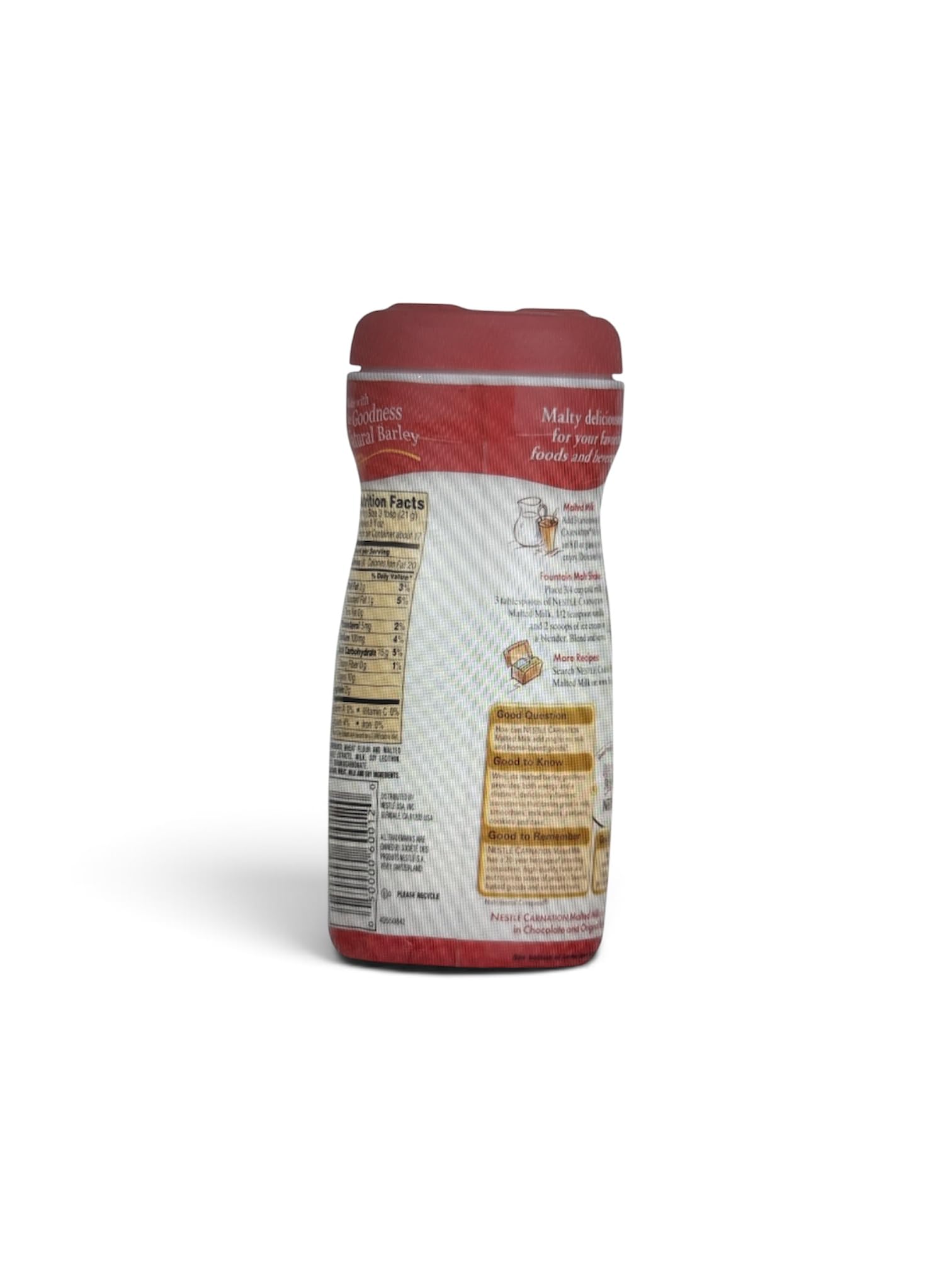 Carnation malted milk spoonful close-up showing powder texture and easy scoopability to flavor drinks and baking