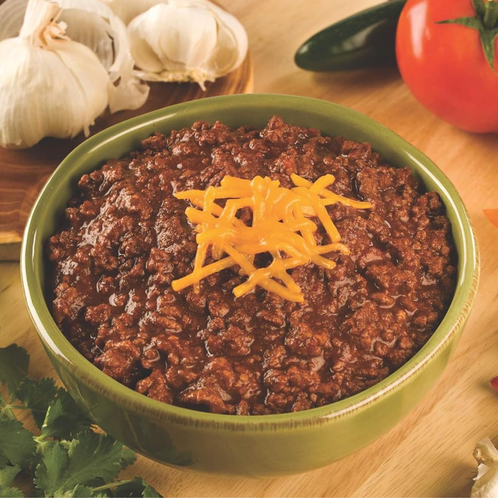 Two-pound meat scale beside prepared chili to show serving size and Carroll Shelby's kit yield per box