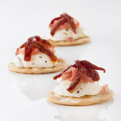 Carr's crackers on a cheese board showing versatile pairing benefit for presentation