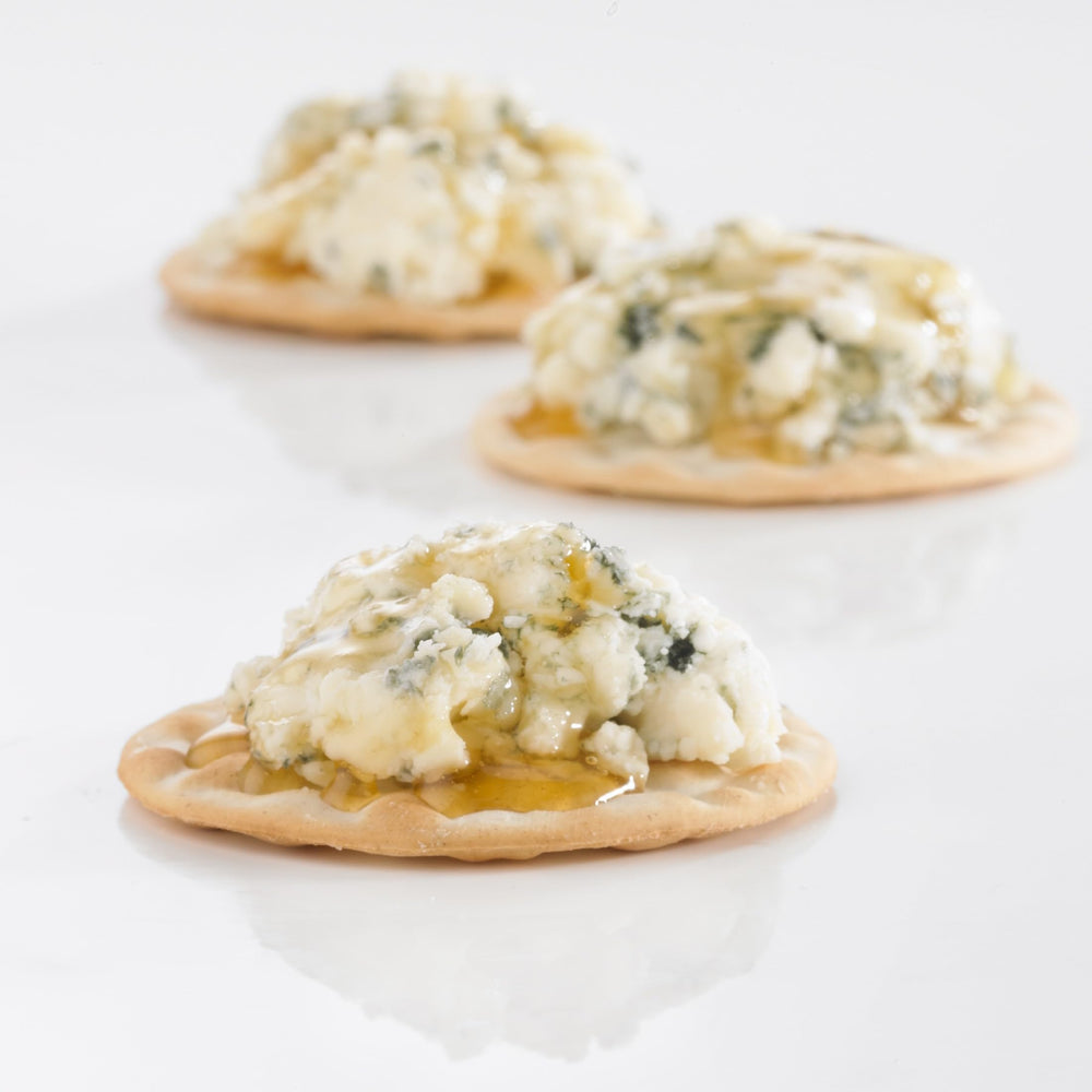 Carr's open portion pack with three crackers demonstrating easy single-serve convenience