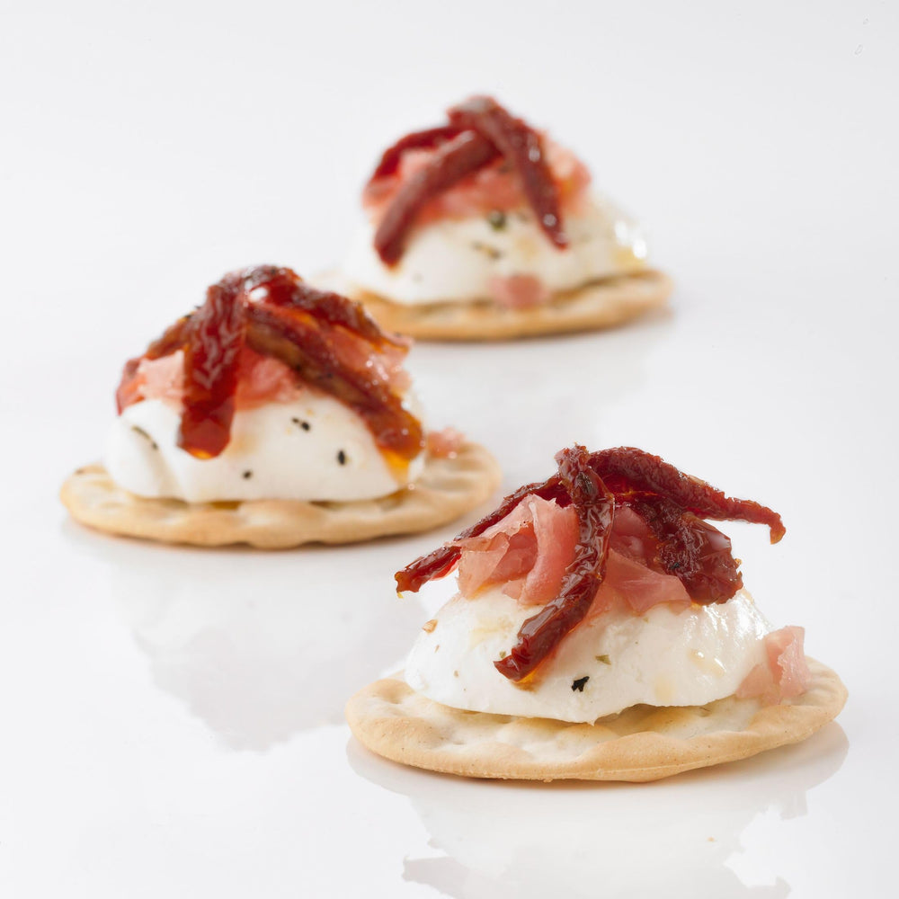Carr's crackers on serveware with canapés highlighting elegant presentation