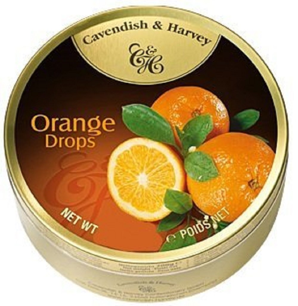 Cavendish tin front view showing gold packaging and orange drops — elegant gift appeal