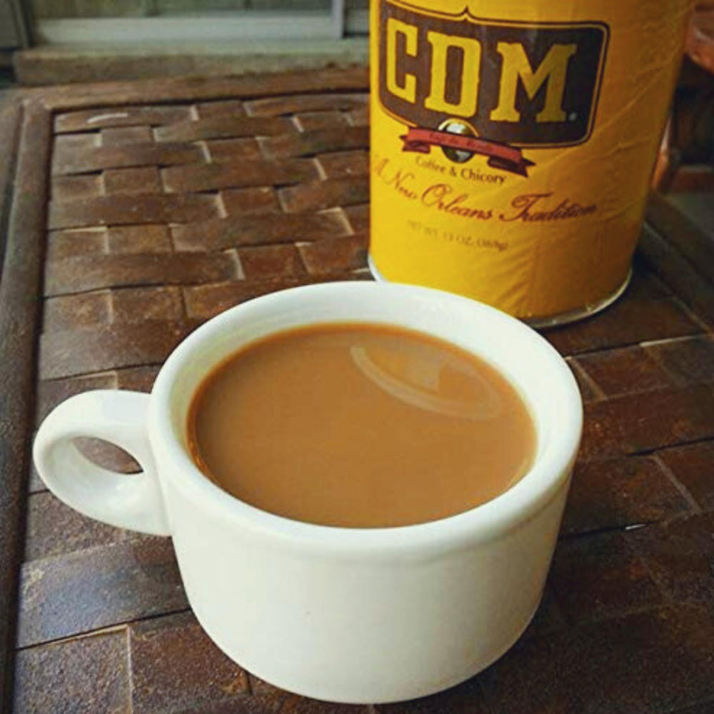 CDM can held in hand showing scale and convenient 13oz size