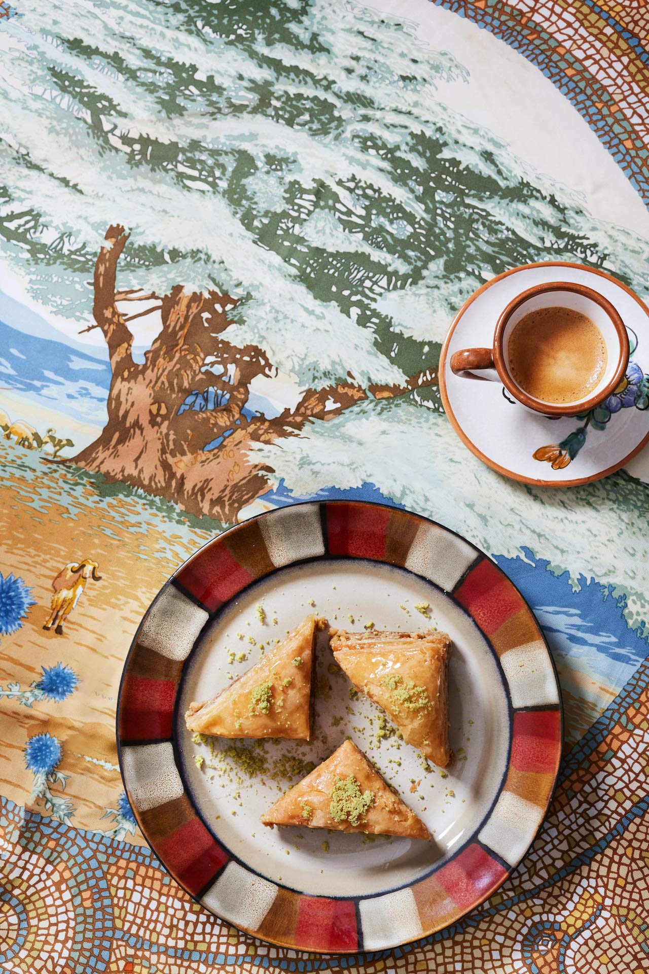 Cedar Pastries triangle baklava held in hand, shows true portable size