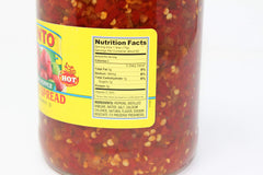 Cento close-up of diced cherry peppers texture, shows crunchy vinegar-packed pieces for bold bite