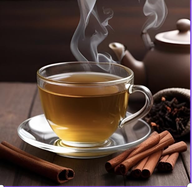Cha4TEA ingredients flatlay with orange peel, cinnamon sticks, and cloves illustrating natural blend