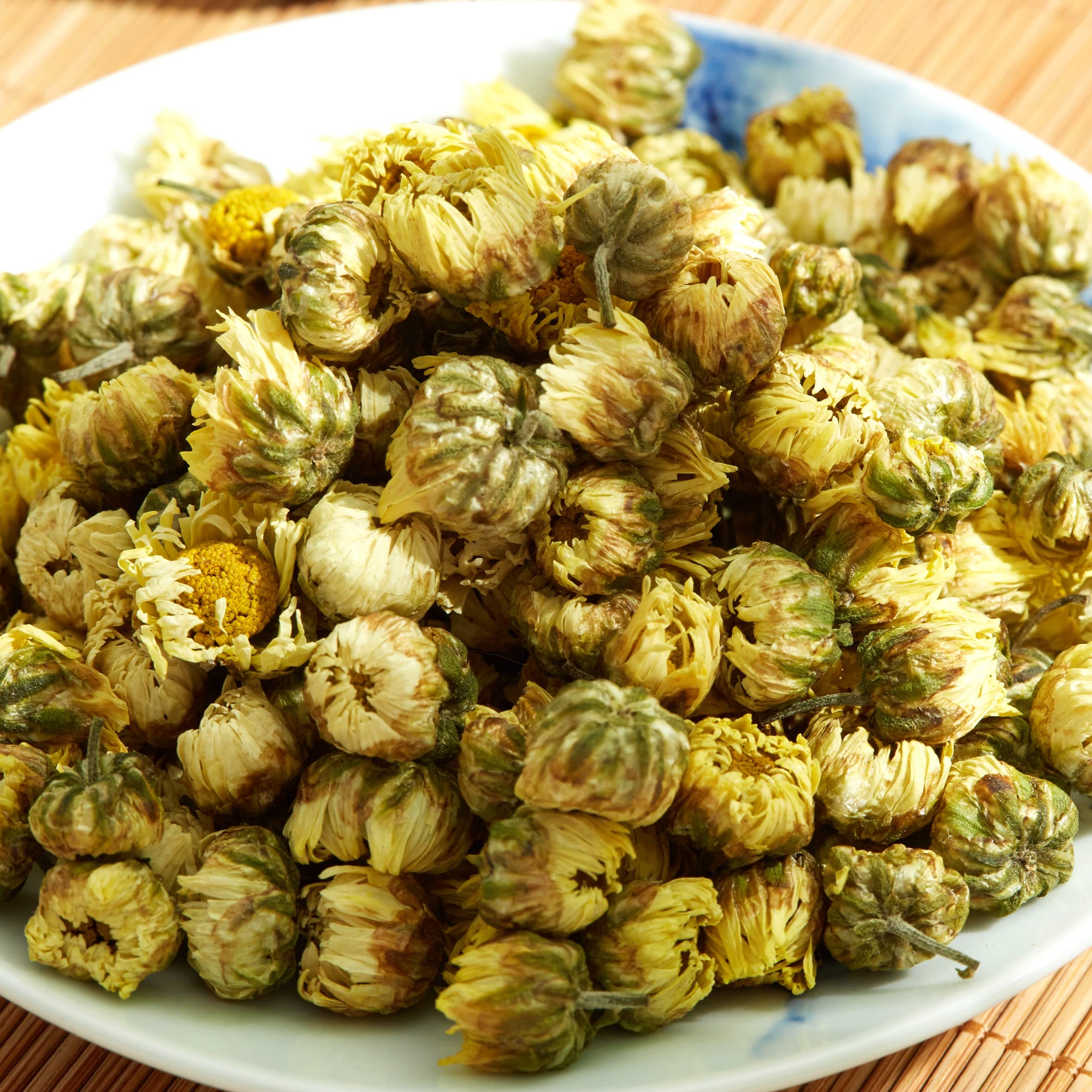 ChaWuWarmSun brewed cup with golden floral tea, bright aroma visible