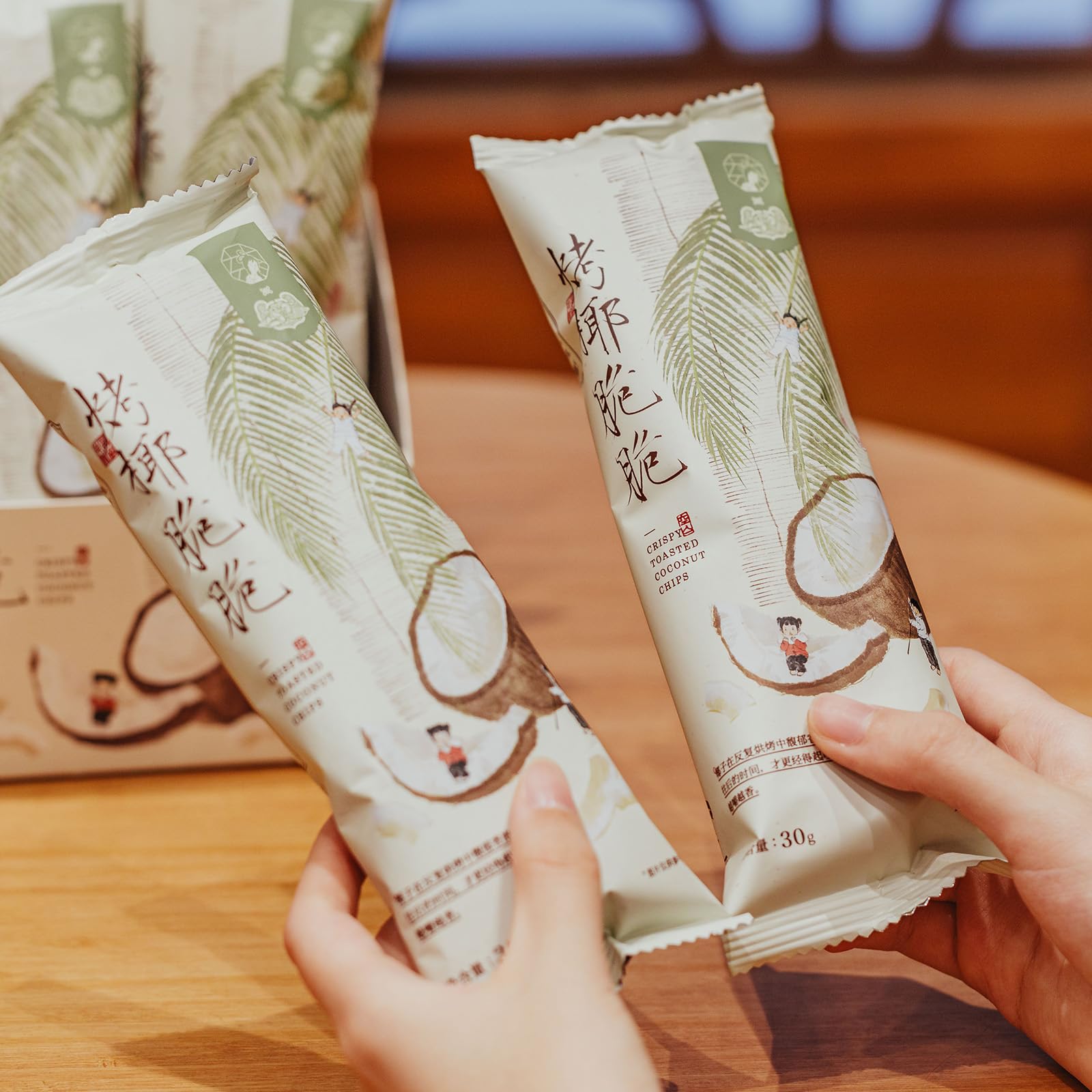 MODERN CHINA TEA SHOP hand holding pouch to illustrate compact size and travel convenience