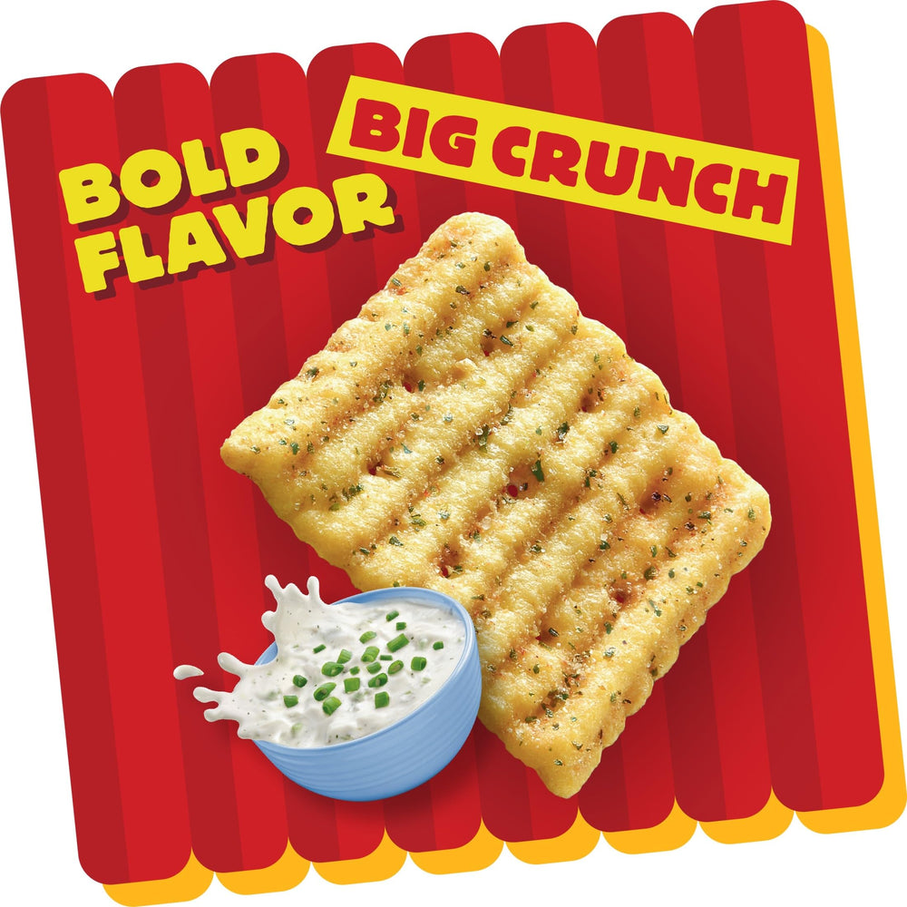 Cheez-It Grooves held in hand showing size and portion convenience