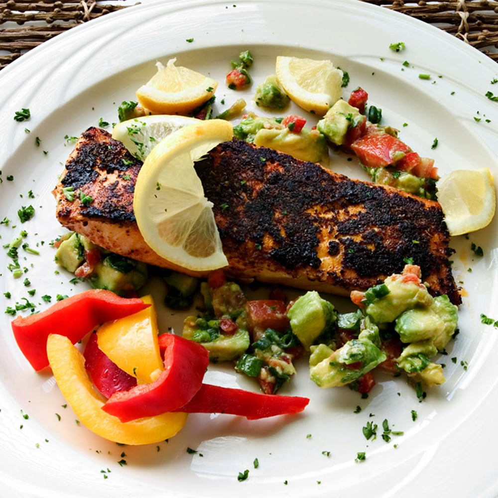 Chef Paul Prudhomme rubbed on chicken demonstrating flavorful char and grill readiness