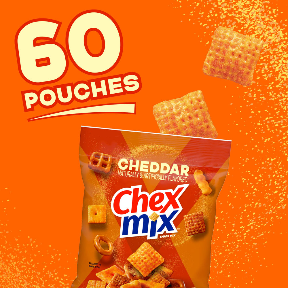 Close-up of Chex Mix pieces showing crunchy texture and cheddar coating