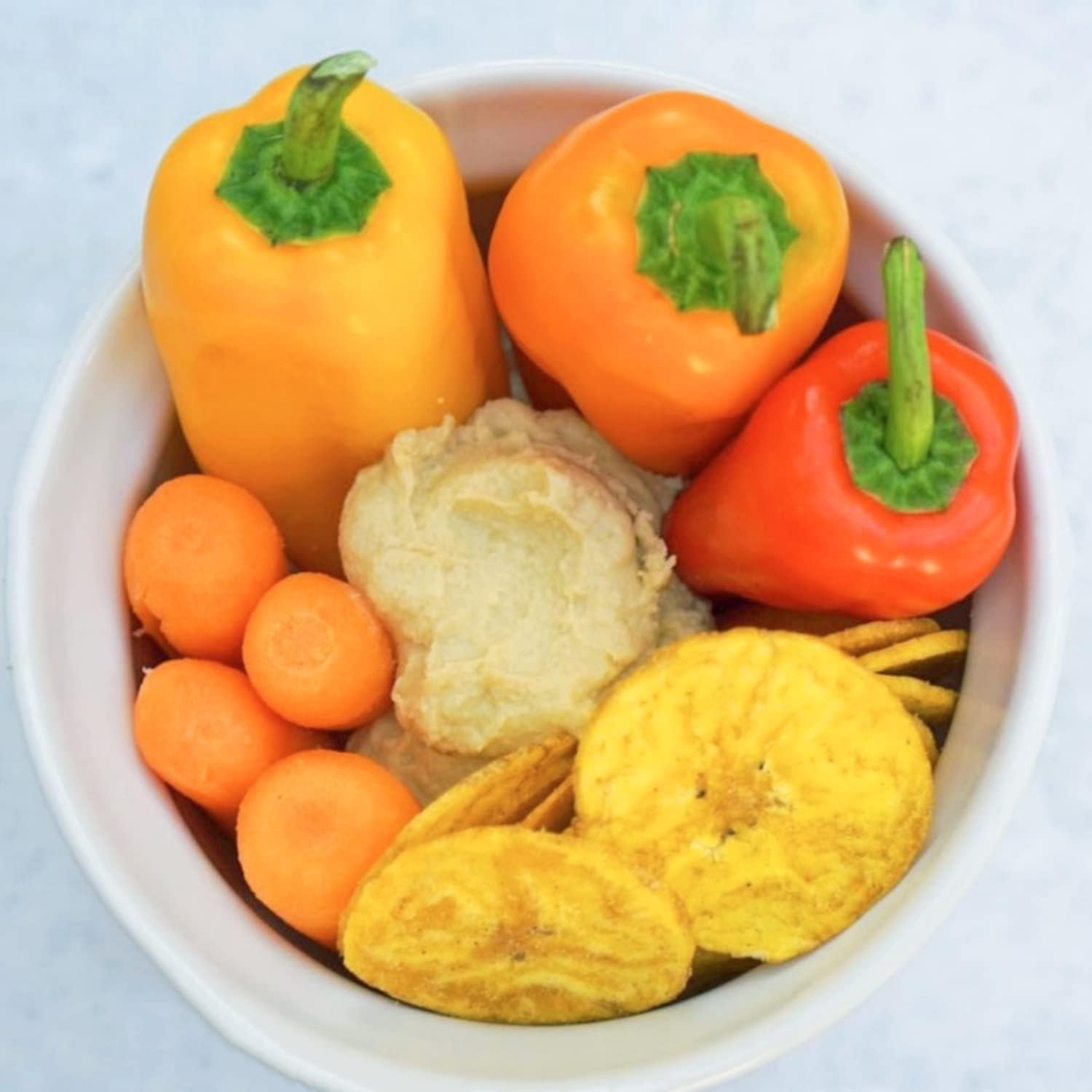 Chifles tub open with chips in bowl ready to serve, ideal for gatherings