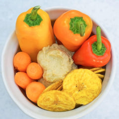 Chifles tub open with chips in bowl ready to serve, ideal for gatherings