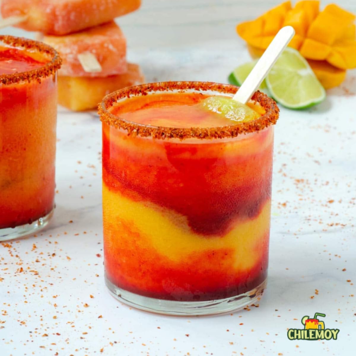 CHILEMOY dipping mango slice demonstrating snack pairing and sweet-tangy benefit