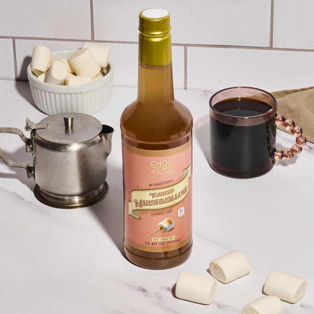 ChocZero bottle next to measuring cup showing 25.4 fl oz size