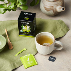 Choice Organic Teas loose green tea leaves with jasmine flowers visible