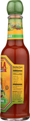 Cholula Chili Lime bottle next to measuring spoon showing compact 5 oz size