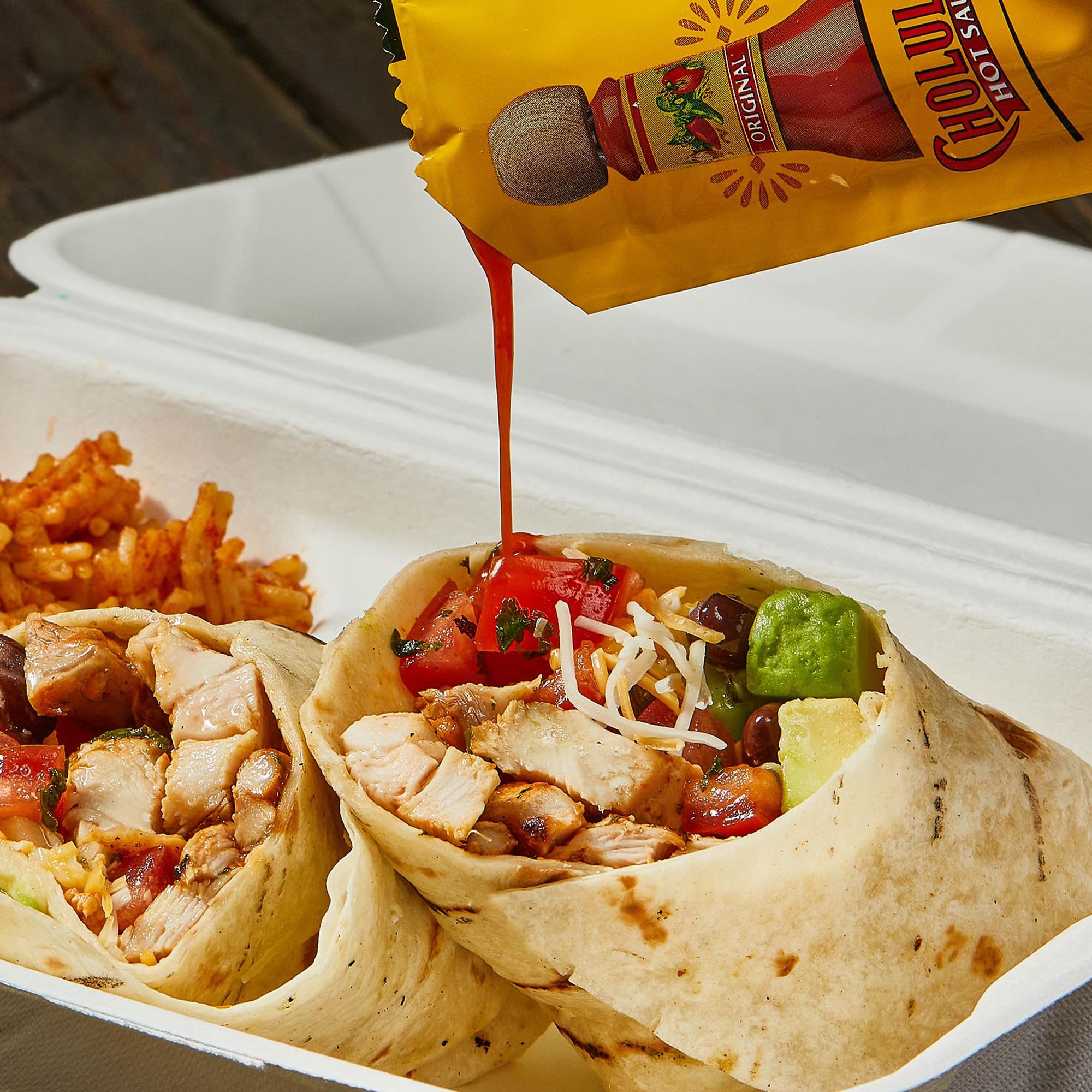 Cholula being drizzled on tacos adding balanced flavor