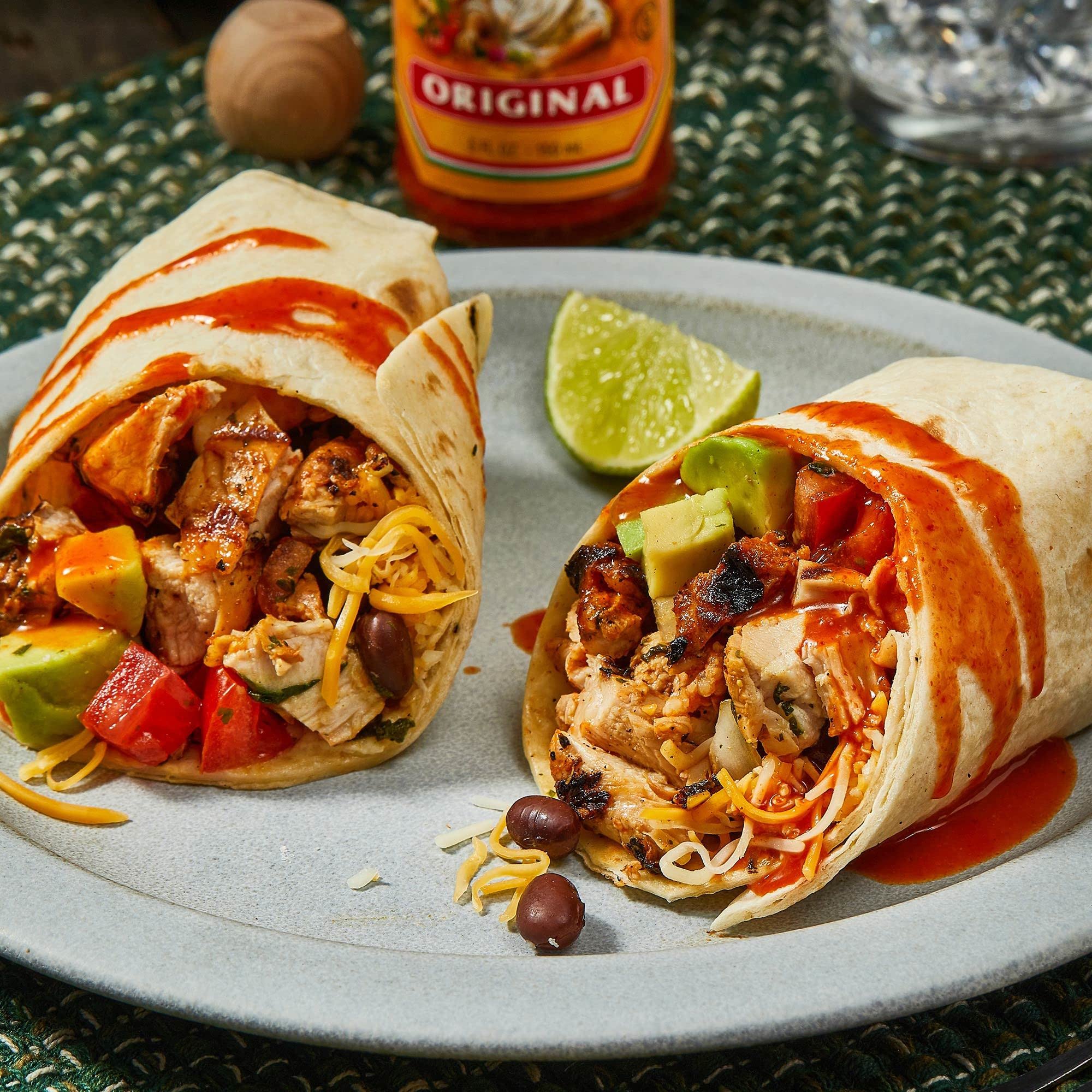 Cholula Original bottle top pouring sauce over food benefit controlled drizzle